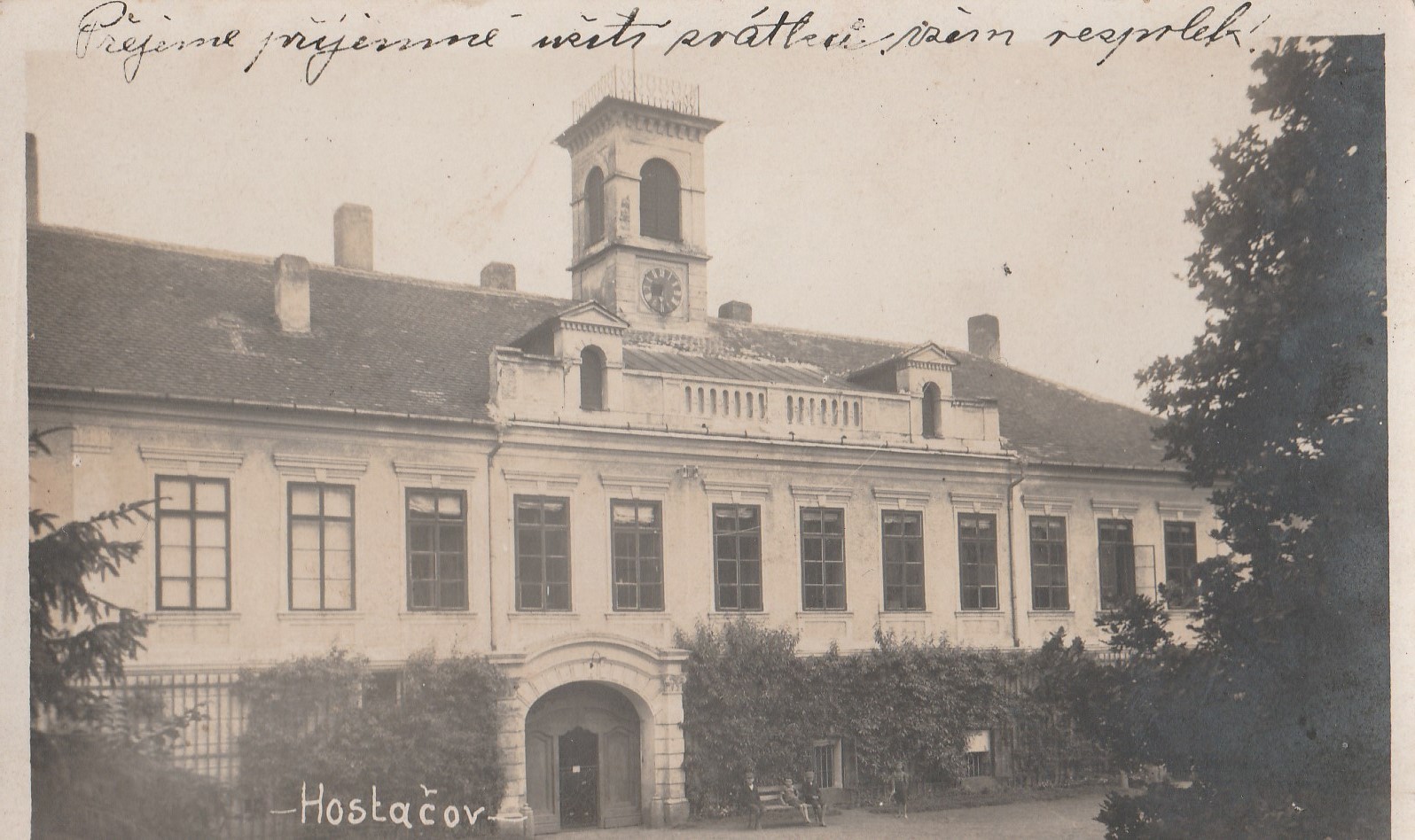 An old photograph of the front of Hostačov with its former tower